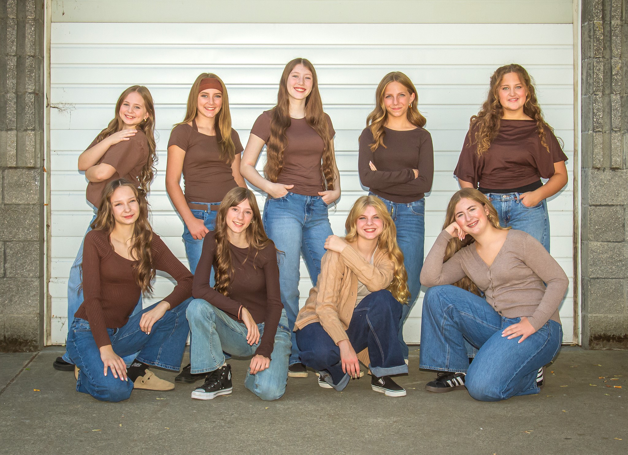 SODC dancers posing together in front of a garage door